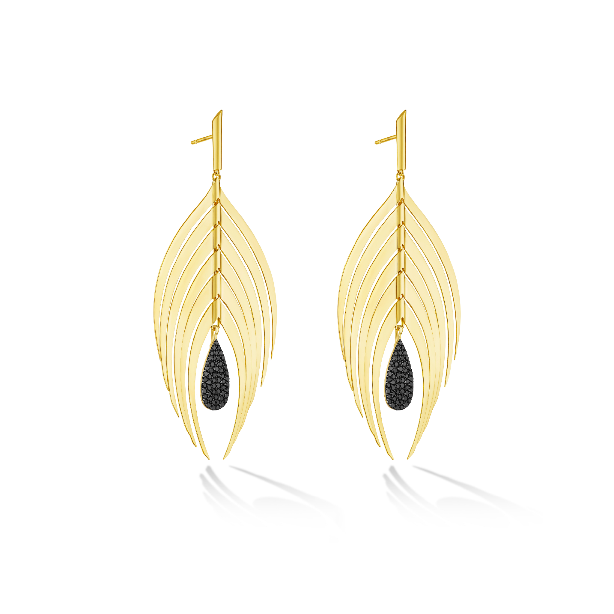 A pair of gold drop earrings designed to look like stylized feathers, with a small black teardrop gemstone hanging from the center, shown on a clean white background with a soft reflection.